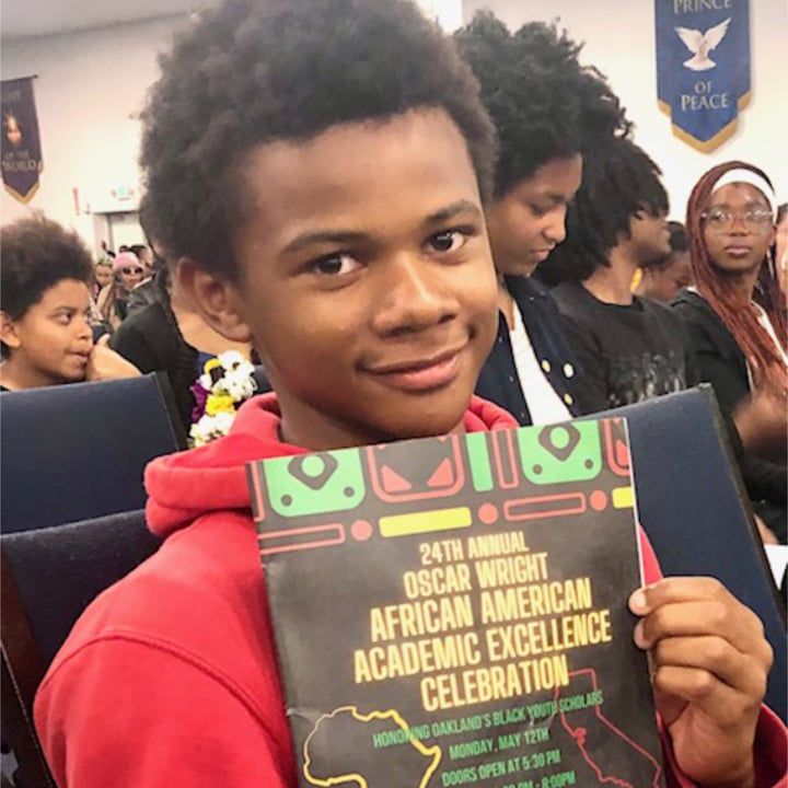 Khardiae Rhodes showing off his Oscar Wright Academic Excellence Award.