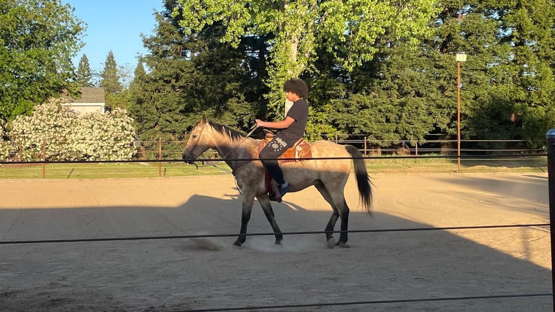IYT Brother, Isiah, enjoying a therapeutic horseback ride.